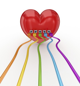 Colorful patch cords connected to a red heart.